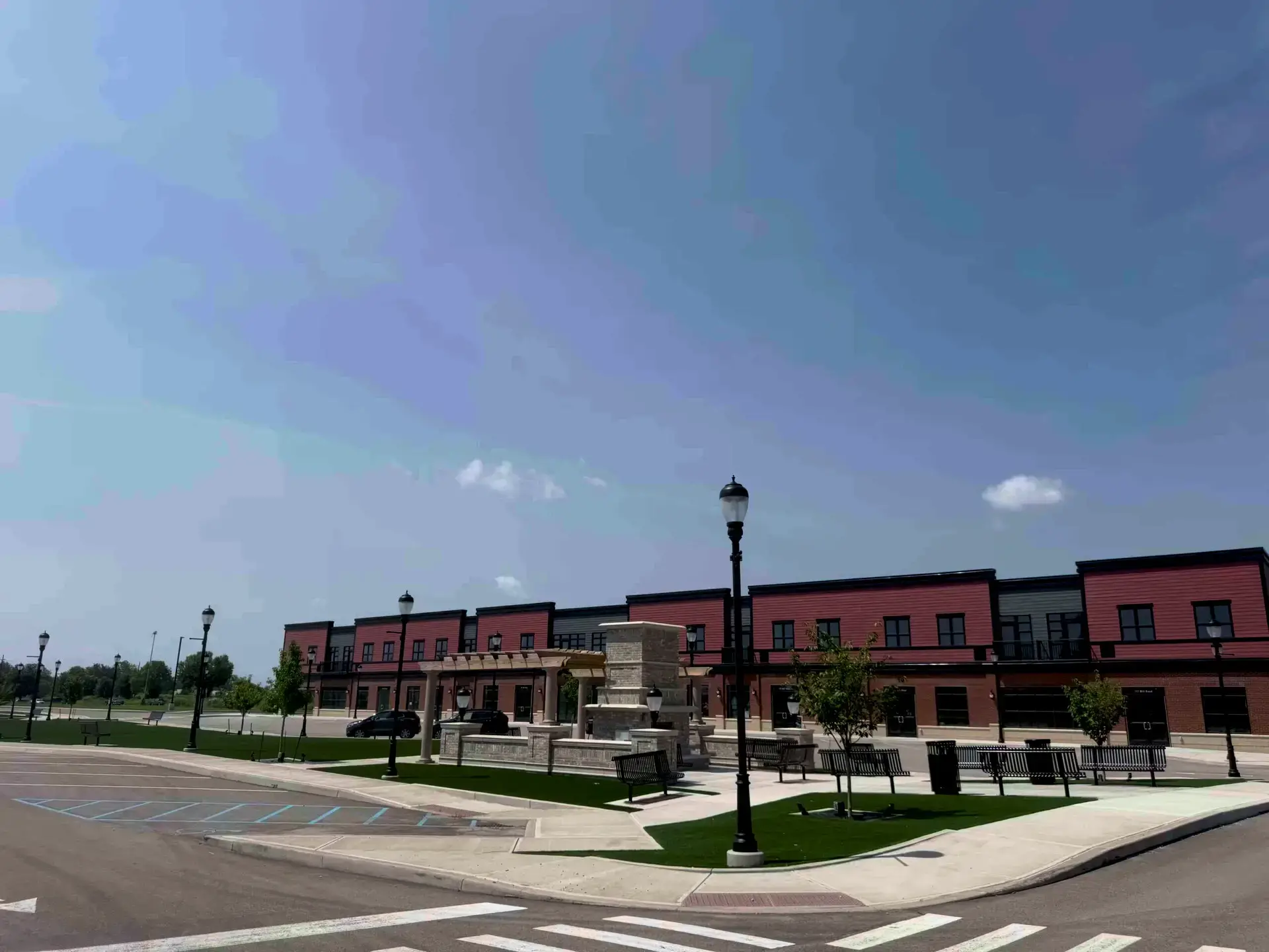 Landscaped plaza with pergola at Park Drive Development